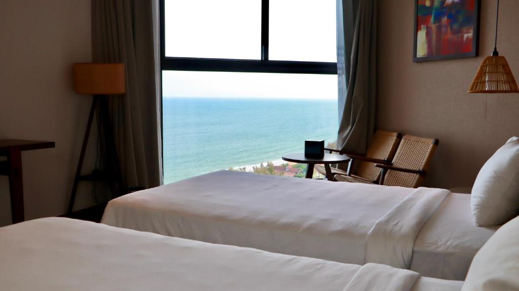 Phòng nghỉ và view biển tại Apec Mandala Mui Ne Beach Apart-Hotel